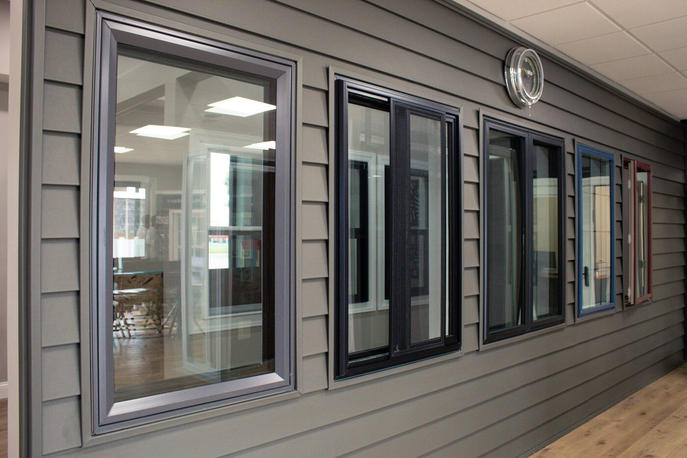 Wall of replacement window samples in the STL Windows Direct showroom